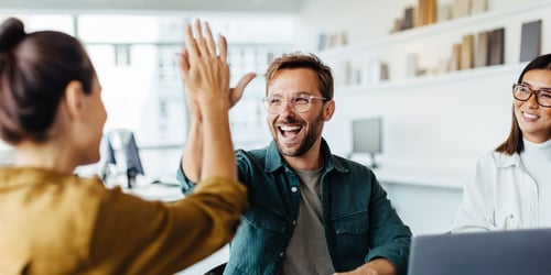 Business people celebrating success in an office