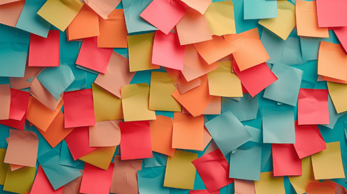 Colorful empty blank sticky notes pasted on an office notice board. Blogpost about executing innovation strategy.