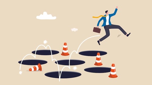 Illustration of person hopping over potholes. Blogpost about avoiding innovation management mistakes.