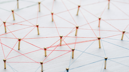 Abstract concept of a network. Nails linked together by threads. Blogpost about Open Collaborative Innovation.