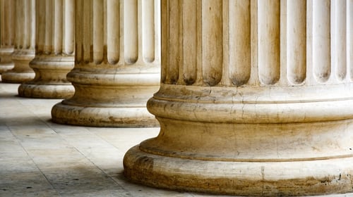 Columns of a building with base, blogpost about organizational resilience.