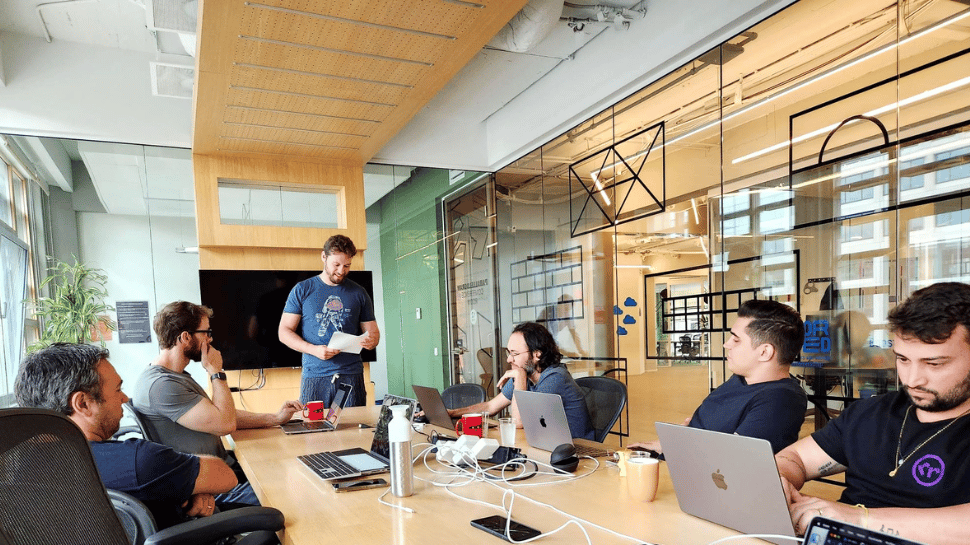 rready Software Engineers gathered around a table for their workshop.