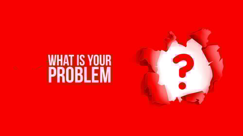 torn paper reveals a question mark regarding finding your innovation problem statement