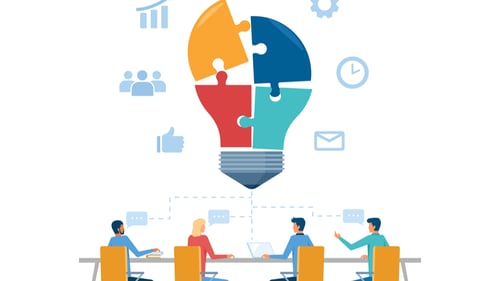 employees sit around a table surrounded by lightbulb and gear icons representing innovation management services