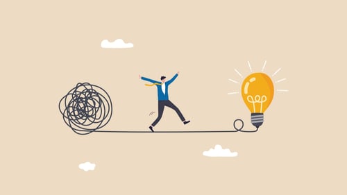 Idea management process represented by a man walking a tightrope to a light bulb