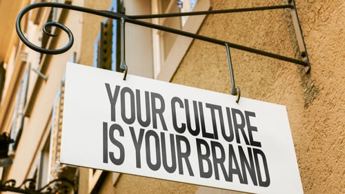 a shop sign says your culture is your brand to reflect the importance of a culture of innovation in organizations.