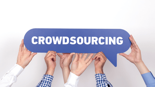 several pairs of hands hold up a speech bubble that represents the crowdsourcing business model