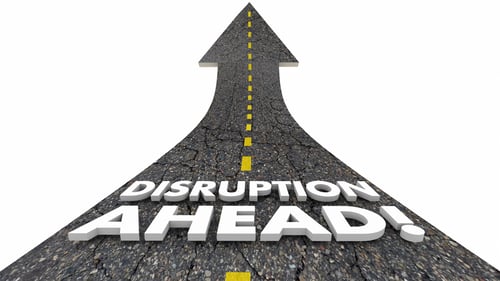 A road that reads disruption ahead talking about disruptive innovation
